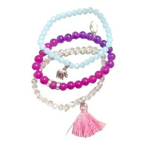 Three beaded bracelets with charms
